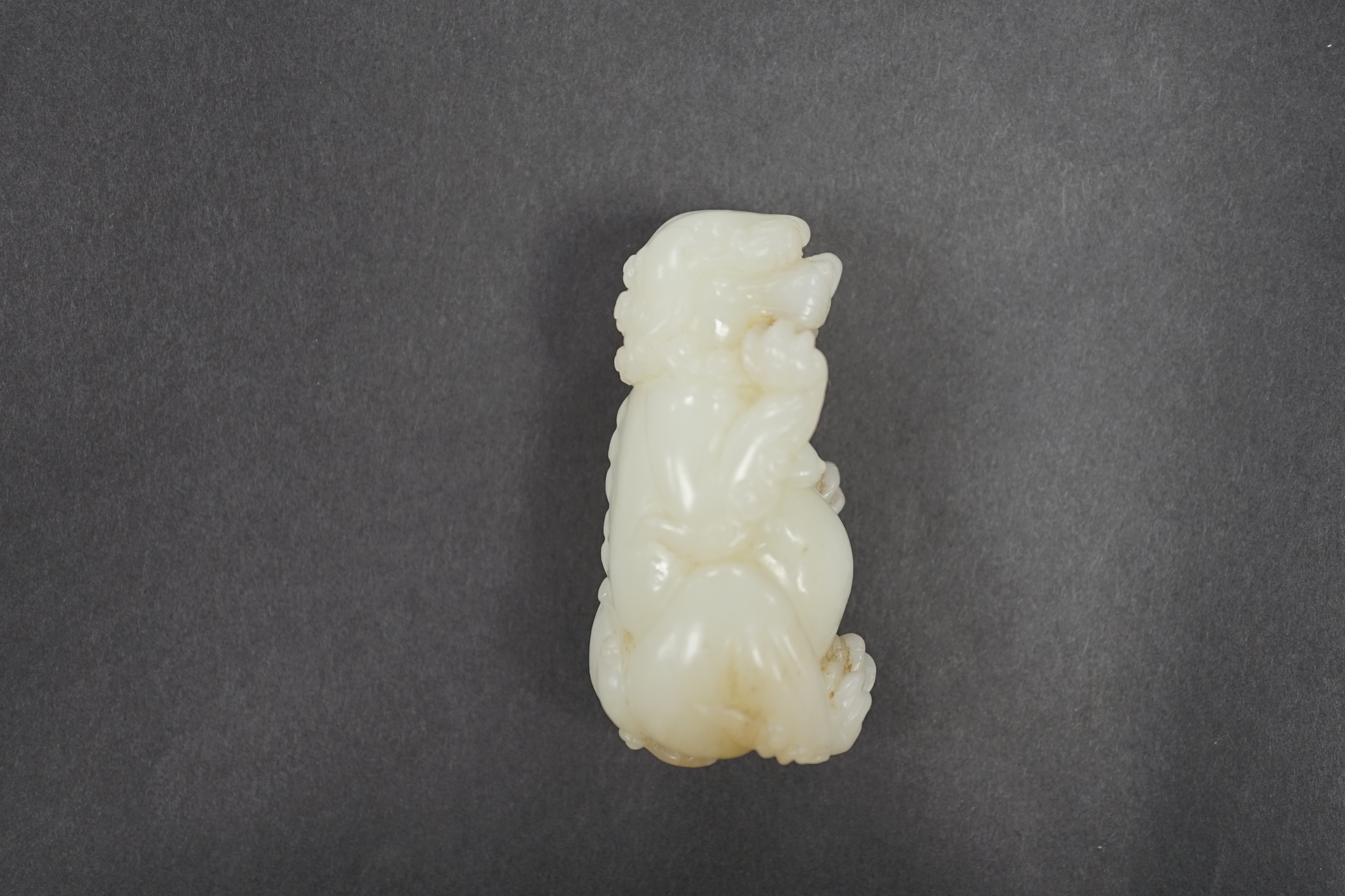 A Chinese white jade lion dog, 7cm
